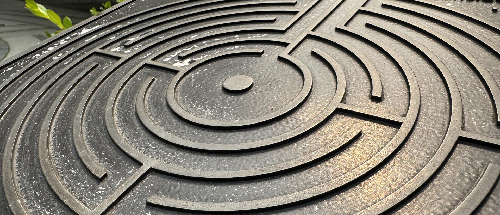 Detail of metal labyrinth on sign