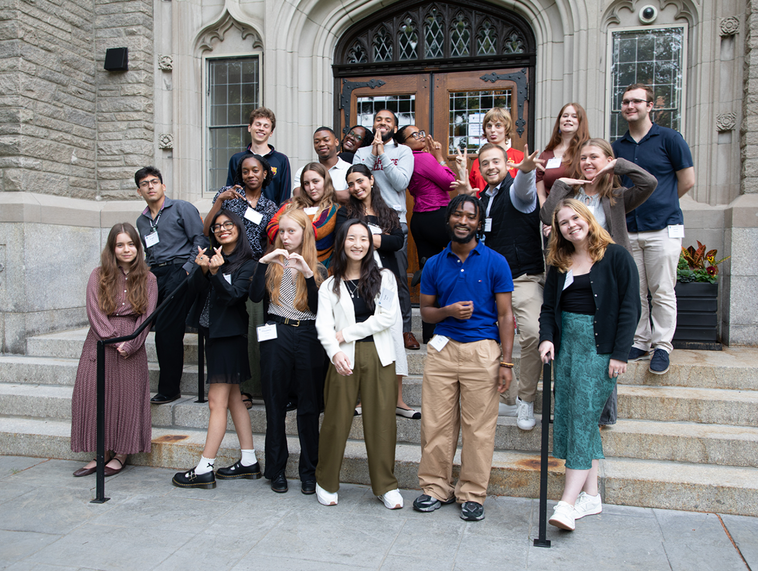 A group of students stands outside of swartz Hall