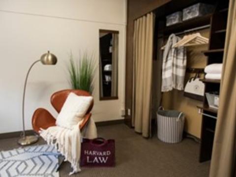 Interior of a dorm at Holmes Hall, HLS with an open closet.