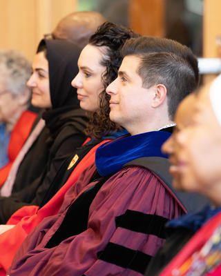 Professors Zegarra and Zurlo look on during Convocation
