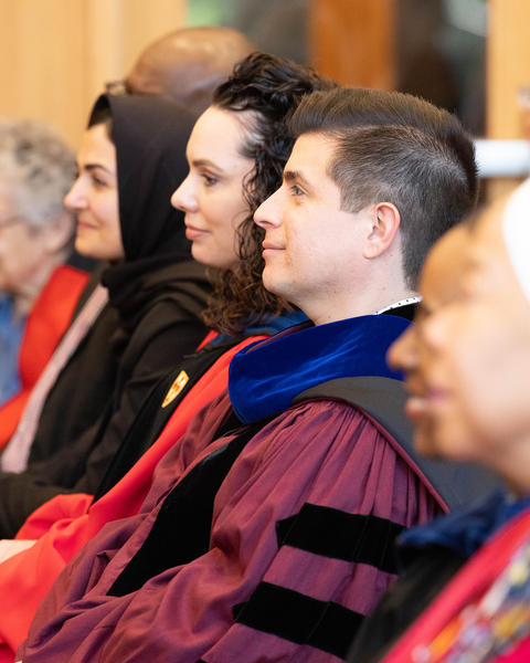 Professors Zegarra and Zurlo look on during Convocation